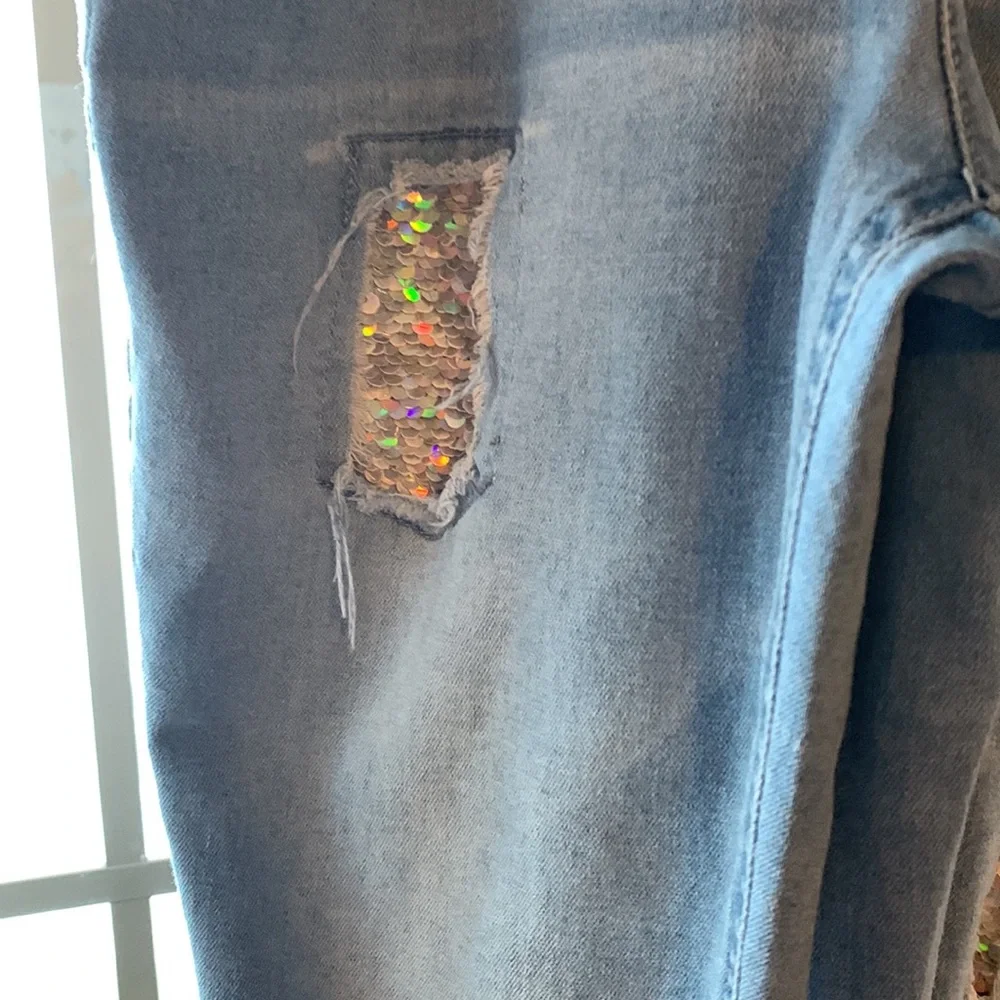 This is a Justice Romper/Jumpsuit, has sequence for holes. - Picture 4 of 6